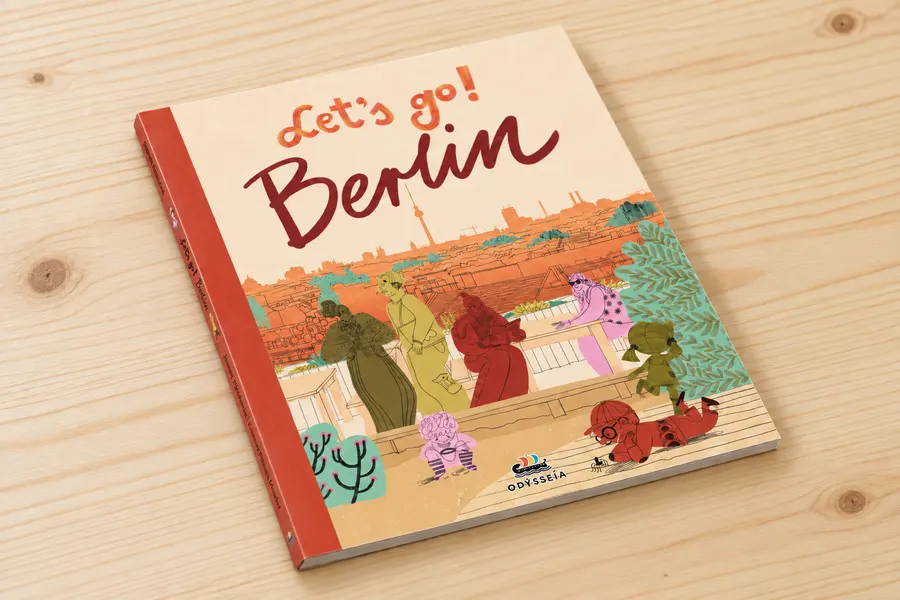 Let's go! Berlin hardcover book on a wooden table