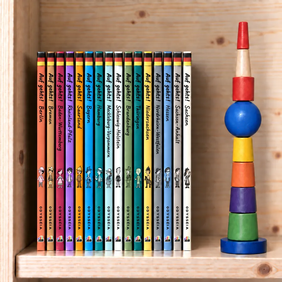 The 'Let's go!' series — sixteen books, one per German federal state, on a shelf